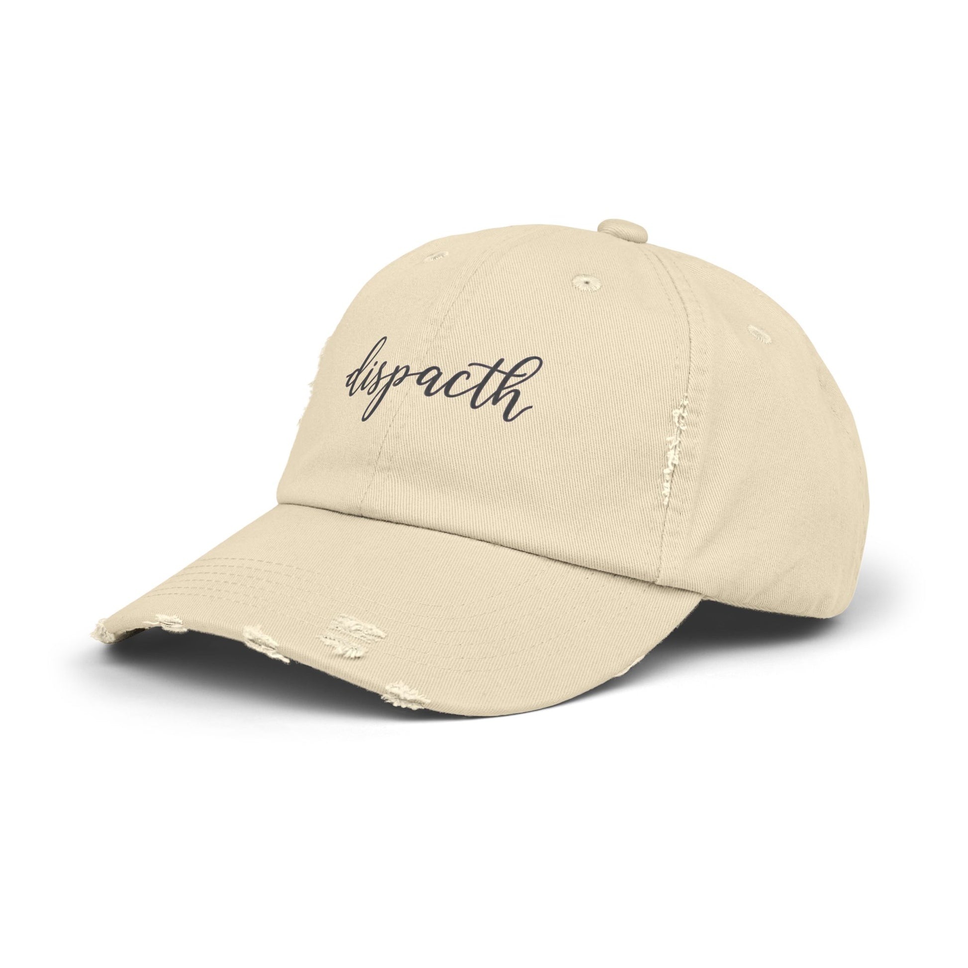 Beige cap with 'dispacth' text on a white background