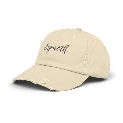 Beige cap with 'dispacth' text on a white background