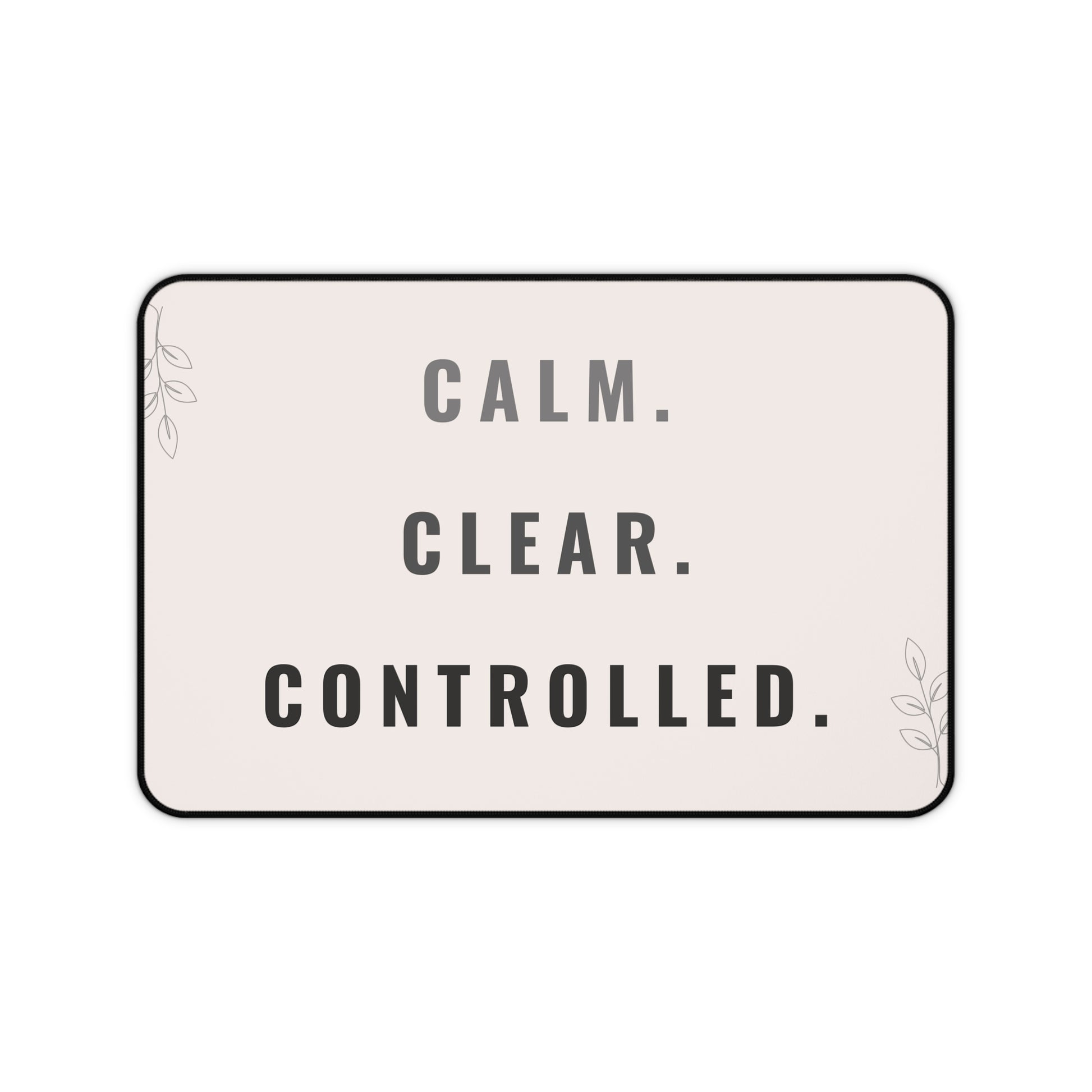 Decorative mat with 'CALM. CLEAR. CONTROLLED.' text on a light pink background