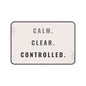 Decorative mat with 'CALM. CLEAR. CONTROLLED.' text on a light pink background