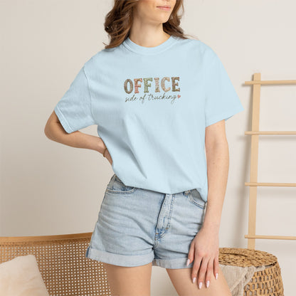 Person wearing a light blue t-shirt with 'OFFICE side of tracking' text, standing against a neutral background.
