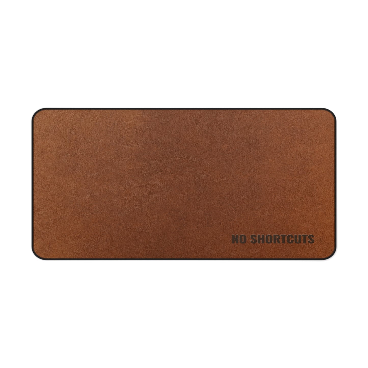 Brown desk mat with 'NO SHORTCUTS' text on a white background