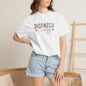 Person wearing a white t-shirt with 'DISPATCH ENERGY' text and denim shorts indoors.