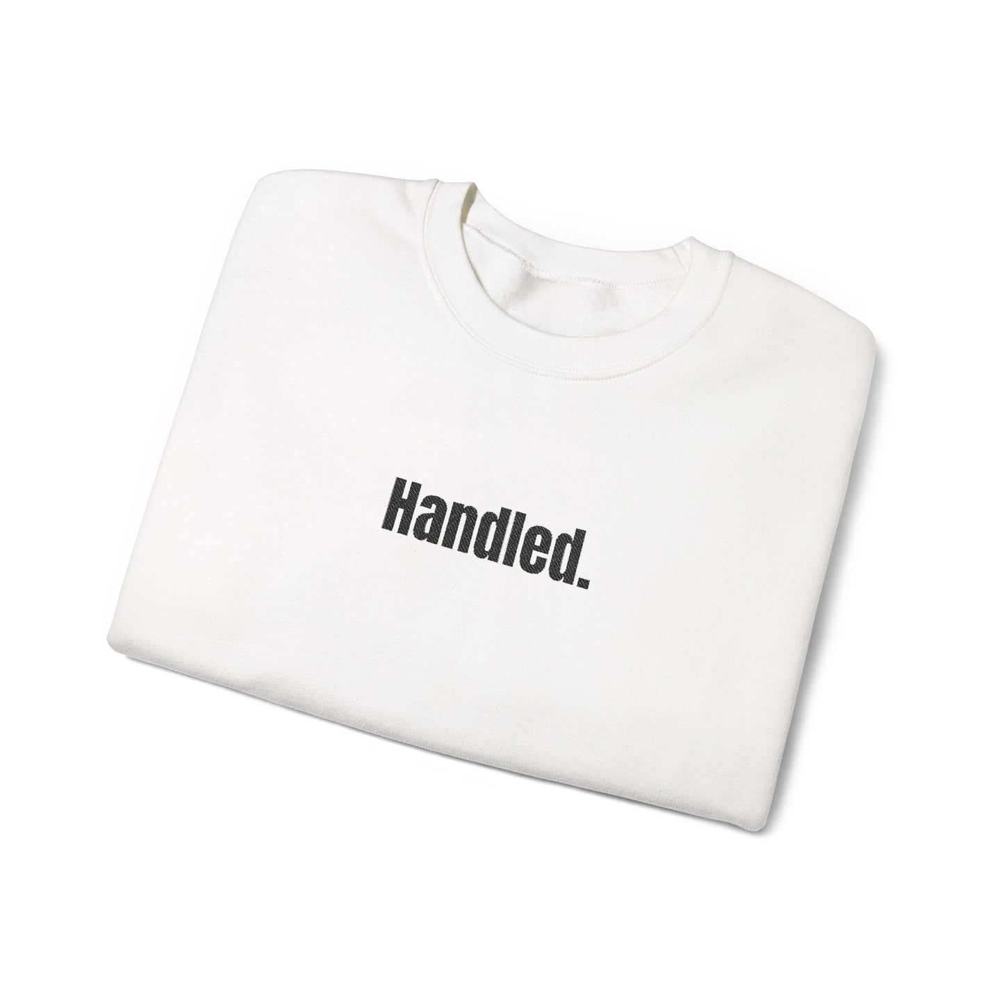White sweatshirt with 'Handled.' text on a white background