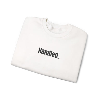 White sweatshirt with 'Handled.' text on a white background
