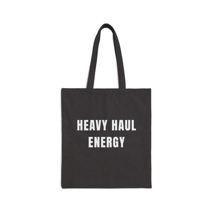 Black tote bag with 'HEAVY HAUL ENERGY' text on a white background