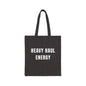 Black tote bag with 'HEAVY HAUL ENERGY' text on a white background