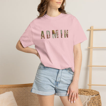 Person wearing a pink t-shirt with 'ADMIN' printed in colorful letters, standing against a neutral background.