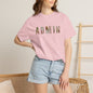 Person wearing a pink t-shirt with 'ADMIN' printed in colorful letters, standing against a neutral background.