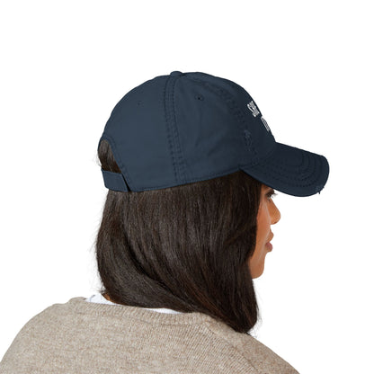 Person wearing a navy blue cap on a white background