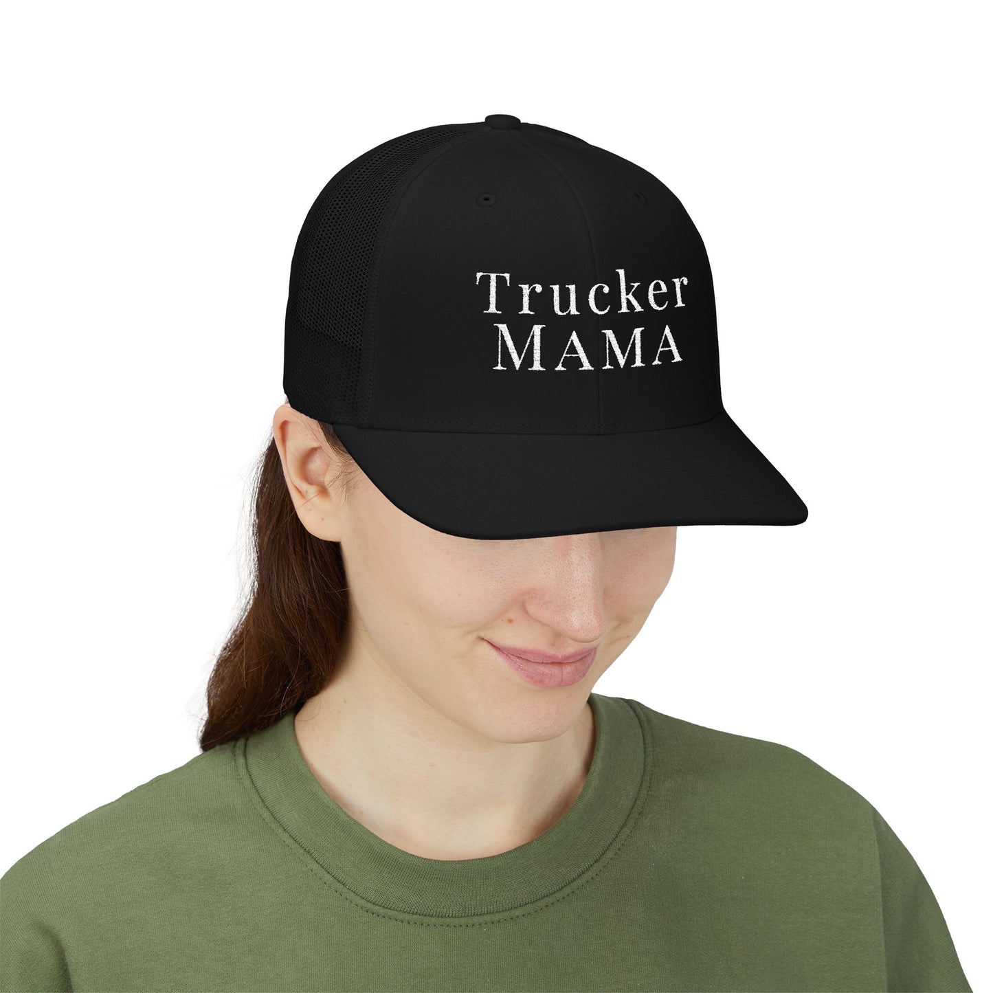 Person wearing a black cap with 'Trucker Mama' text on a white background