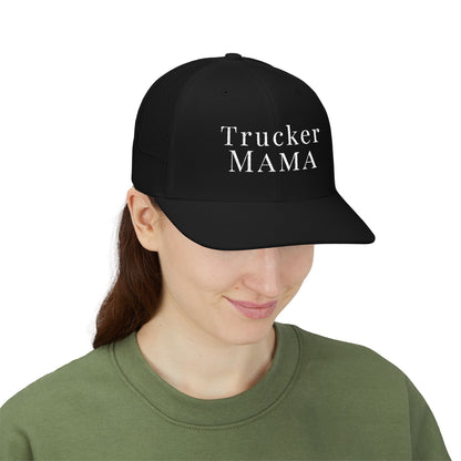 Person wearing a black cap with 'Trucker Mama' text on a white background