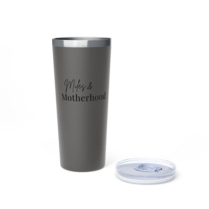 Gray tumbler with 'Miles & Motherhood' text on a white background