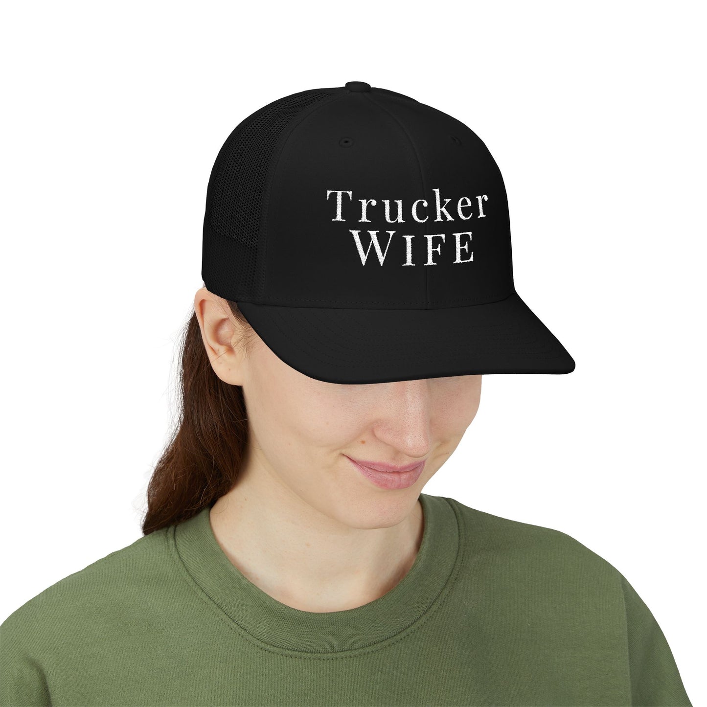 Person wearing a black cap with 'Trucker Wife' text on a white background