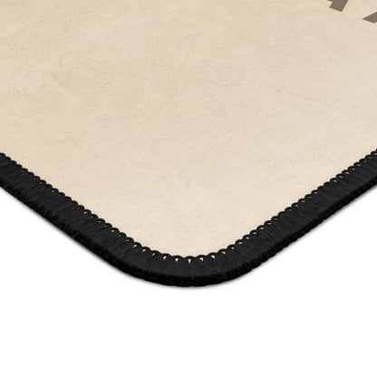 Beige rug with black border on a white background