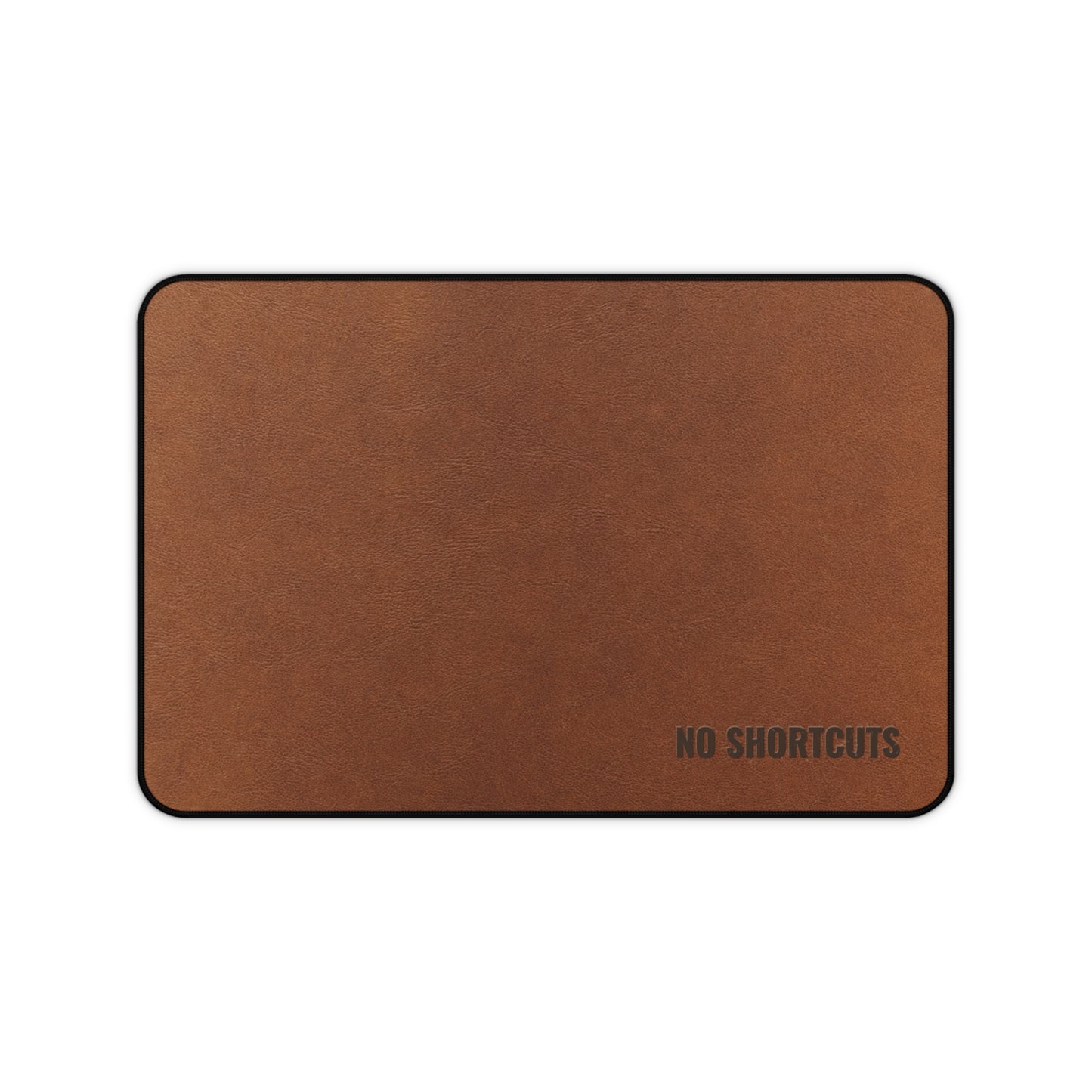 Brown mouse pad with 'NO SHORTCUTS' text on a white background