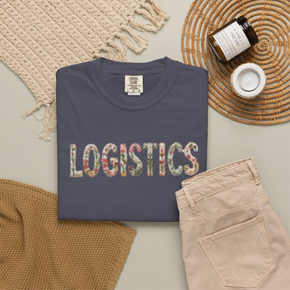 Navy blue TSHIRT with 'LOGISTICS' in colorful letters on a neutral background