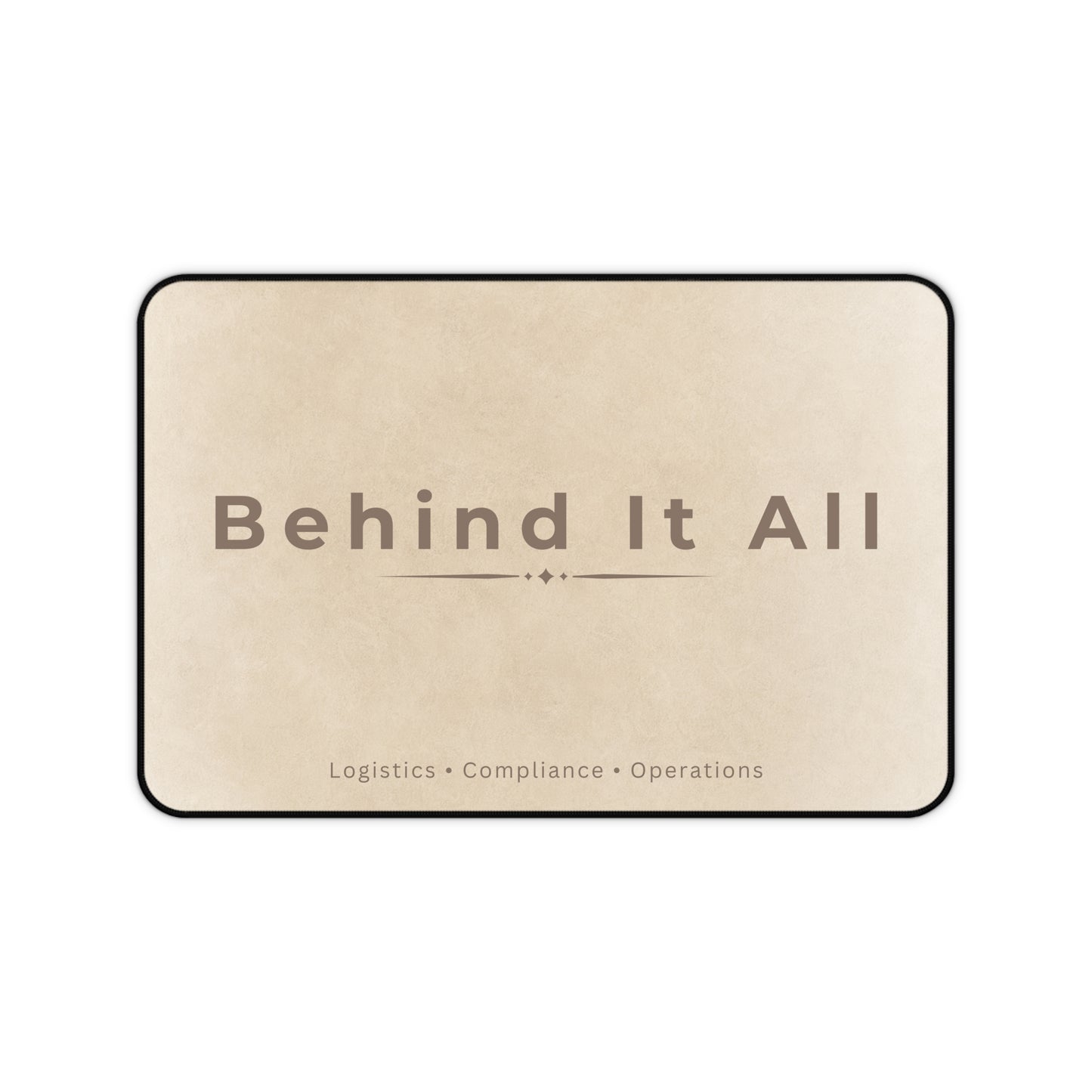 Beige mat with 'Behind It All' text on a white background