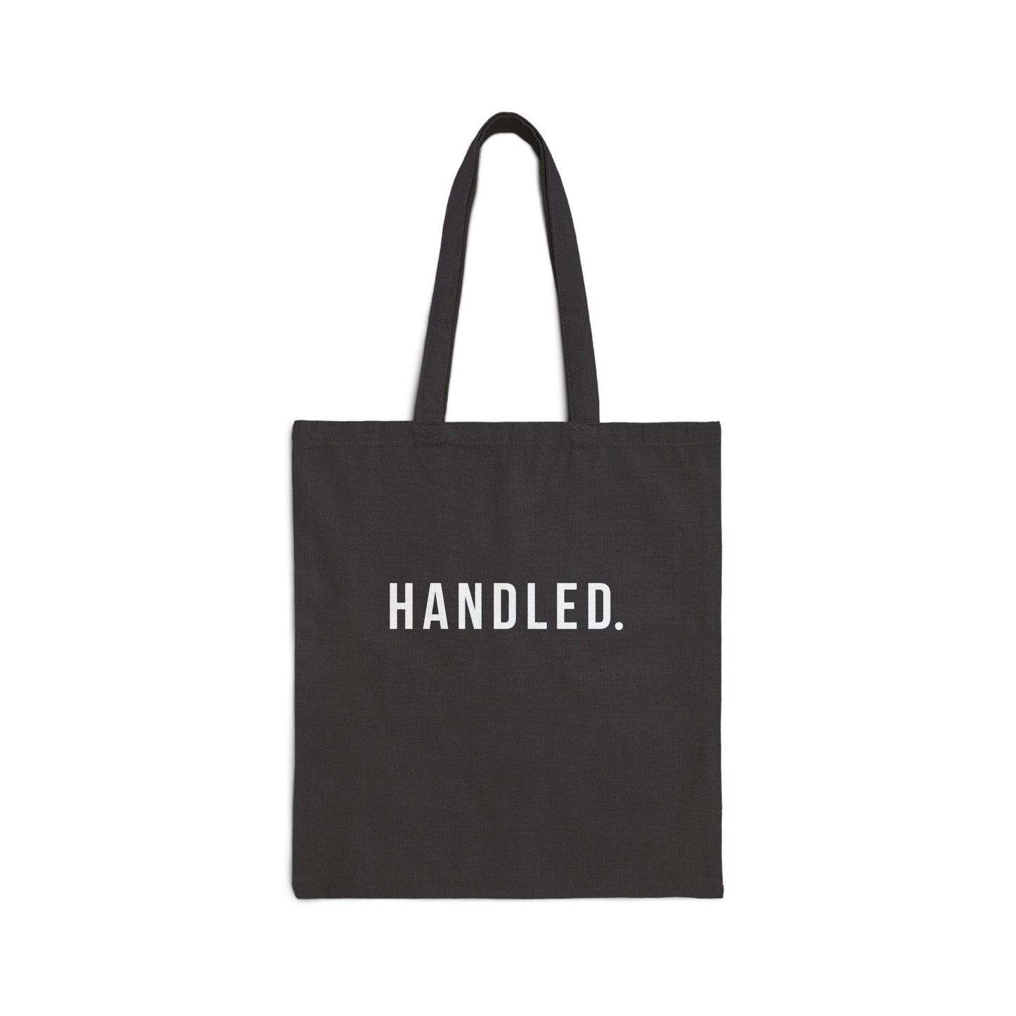 Black tote bag with white text on a white background