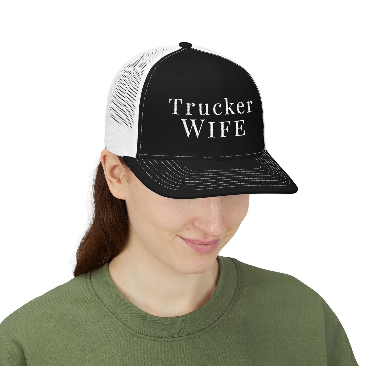 Person wearing a black and white cap with 'Trucker Wife' text on a white background