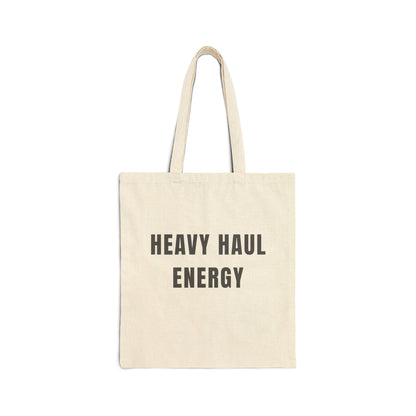 Beige tote bag with 'HEAVY HAUL ENERGY' text on a white background