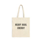 Beige tote bag with 'HEAVY HAUL ENERGY' text on a white background