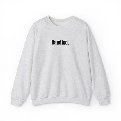 Gray sweatshirt with 'Handled.' text on a white background
