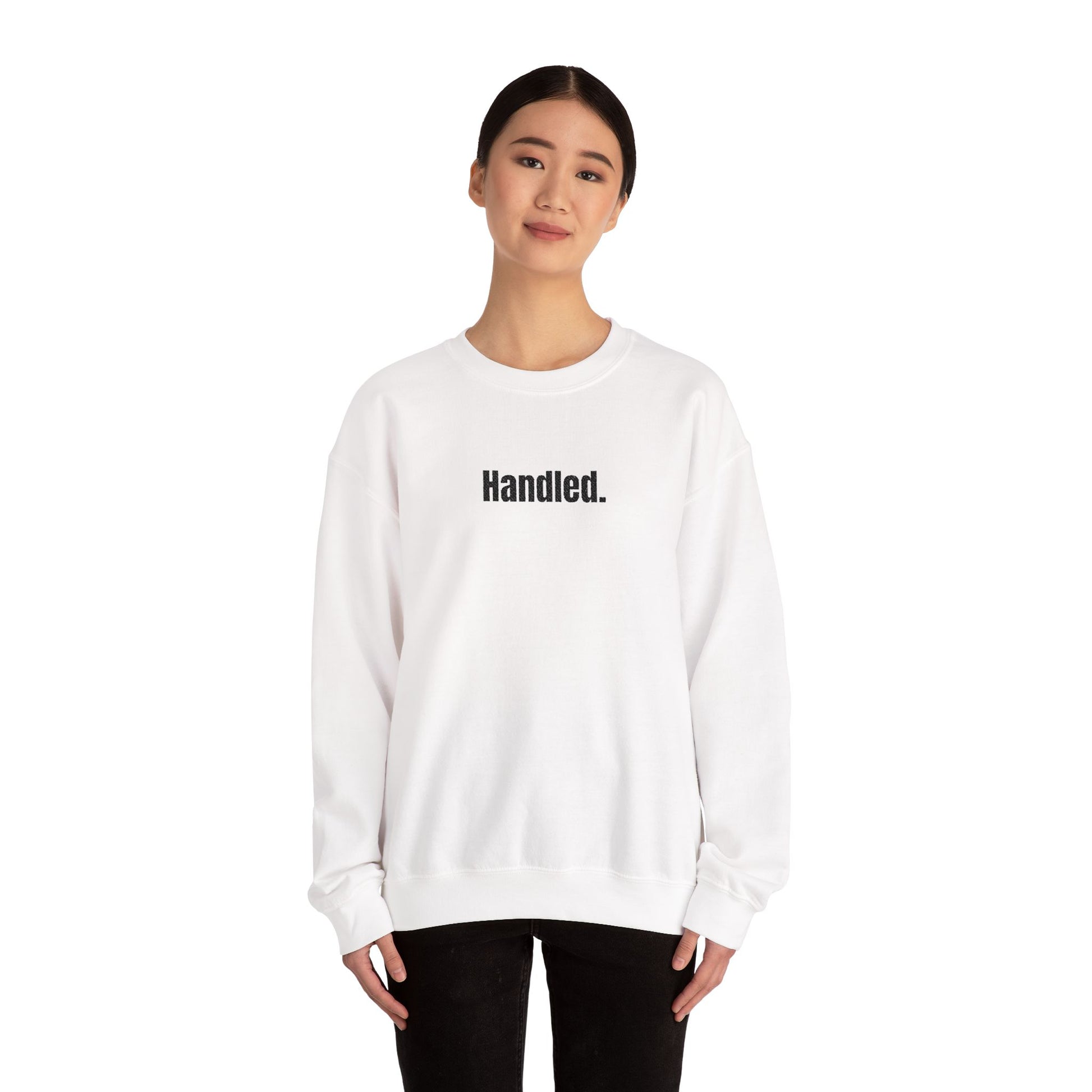 Person wearing a white sweatshirt with text on a white background