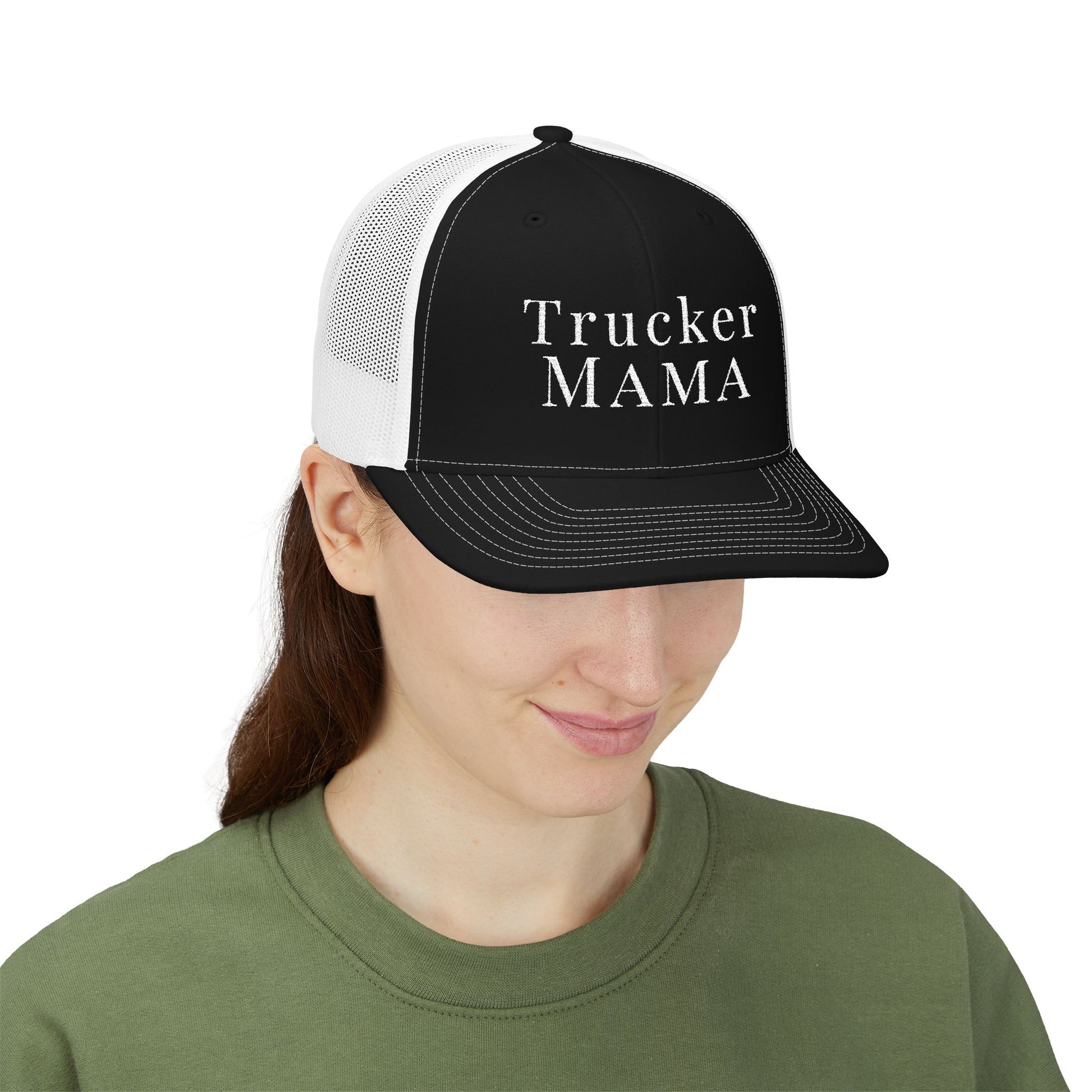 Person wearing a black and white cap with 'Trucker mama' text on a white background