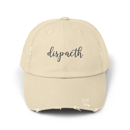 Beige cap with 'dispacth' text on a white background
