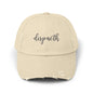 Beige cap with 'dispacth' text on a white background