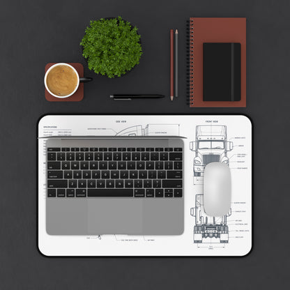 Laptop on a desk with a coffee cup, plant, and office supplies on a dark surface